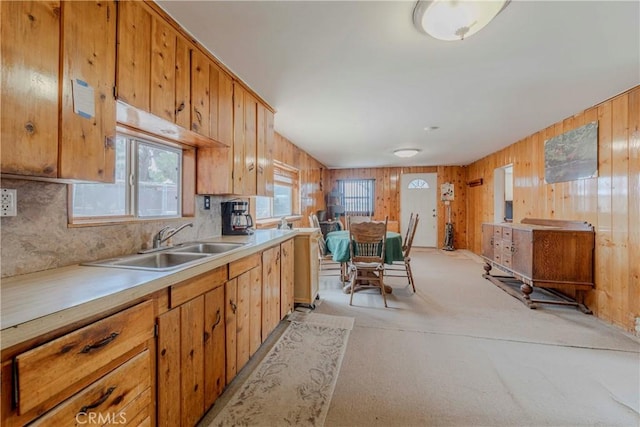 8288 White Rd, Phelan, CA 92371 - kitchen with backsplash, wood walls, light countertops, light carpet, and brown cabinets
