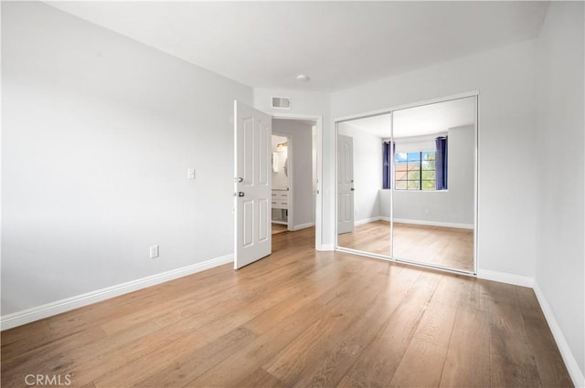 4017 Cottonwood Grove Trl, Calabasas, CA 91301 - unfurnished bedroom with light wood finished floors, baseboards, and a closet