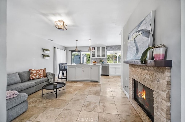 4017 Cottonwood Grove Trl, Calabasas, CA 91301 - living room featuring light tile patterned floors and a fireplace