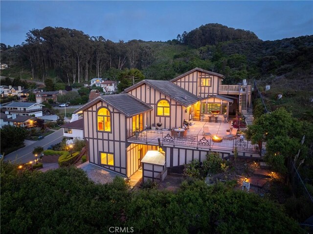 2743 Rodman Dr, Los Osos, CA 93402 - rear view of property with a wooded view, a chimney, and a balcony