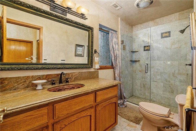 2743 Rodman Dr, Los Osos, CA 93402 - full bathroom featuring a stall shower, toilet, vanity, and tile patterned flooring