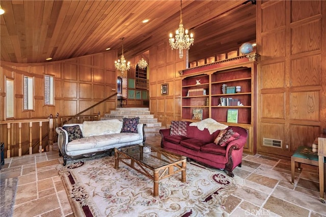 2743 Rodman Dr, Los Osos, CA 93402 - living room with a chandelier, stone tile flooring, vaulted ceiling, stairway, and wood ceiling