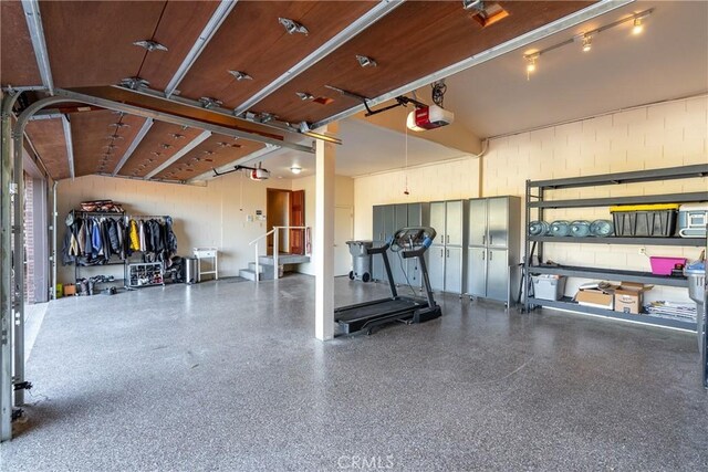 2743 Rodman Dr, Los Osos, CA 93402 - garage with a garage door opener and concrete block wall