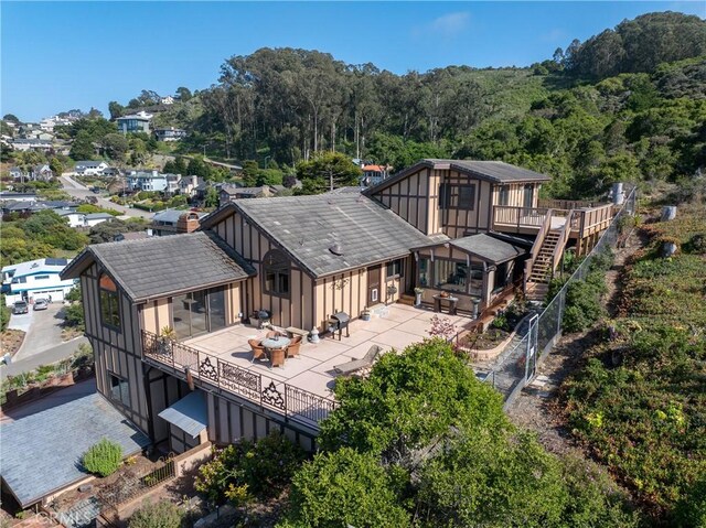2743 Rodman Dr, Los Osos, CA 93402 - back of property featuring stairs, a deck, fence, a patio, and a wooded view