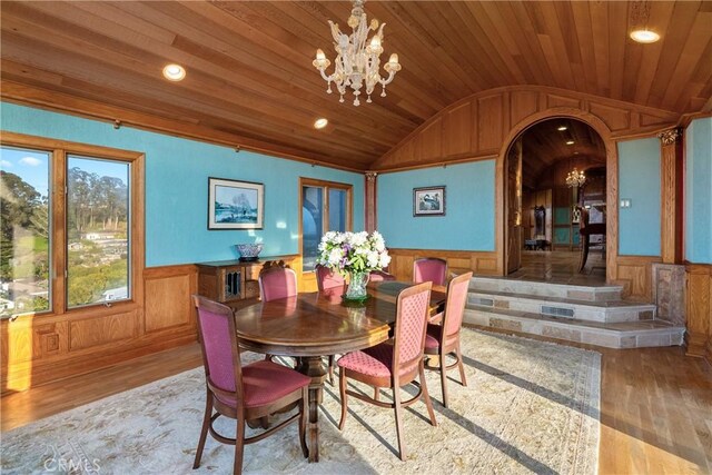 2743 Rodman Dr, Los Osos, CA 93402 - dining room with lofted ceiling, wooden ceiling, hardwood / wood-style flooring, a chandelier, and arched walkways