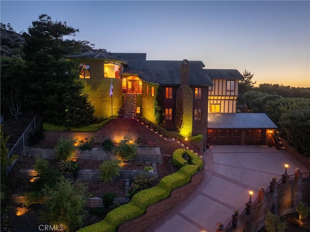 2743 Rodman Dr, Los Osos, CA 93402 - view of front facade featuring stairway, driveway, a garage, and a chimney