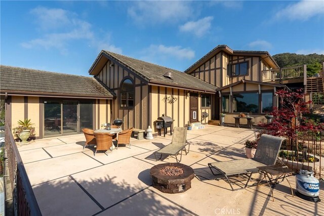 2743 Rodman Dr, Los Osos, CA 93402 - back of house featuring an outdoor fire pit, a patio area, outdoor dining space, and stucco siding