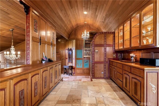 2743 Rodman Dr, Los Osos, CA 93402 - kitchen featuring a chandelier, lofted ceiling, brown cabinets, and wooden ceiling