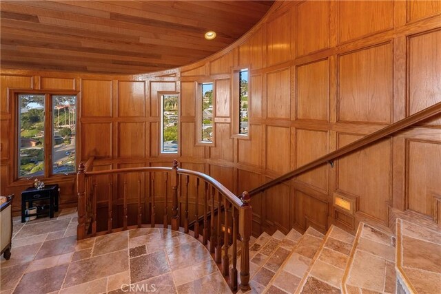 2743 Rodman Dr, Los Osos, CA 93402 - stairway featuring wood ceiling, stone tile flooring, and a wood stove
