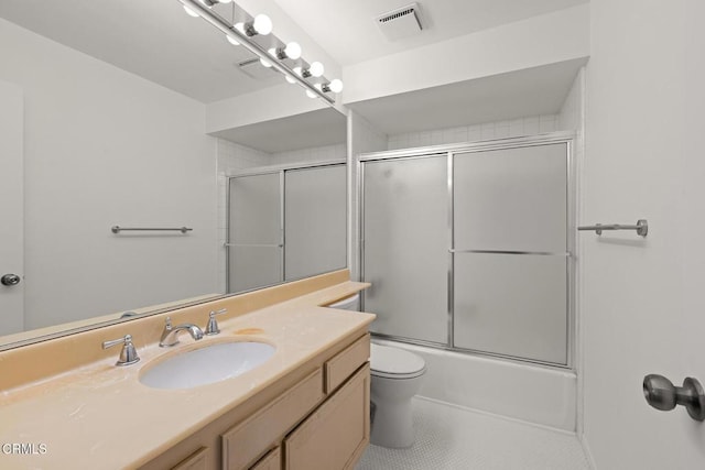 72460 Rodeo Way, Rancho Mirage, CA 92270 - full bathroom with vanity, toilet, tile patterned flooring, and bath / shower combo with glass door