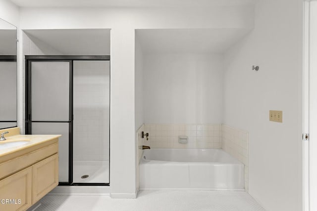 72460 Rodeo Way, Rancho Mirage, CA 92270 - full bathroom featuring vanity, tile patterned flooring, a bath, a shower stall, and baseboards