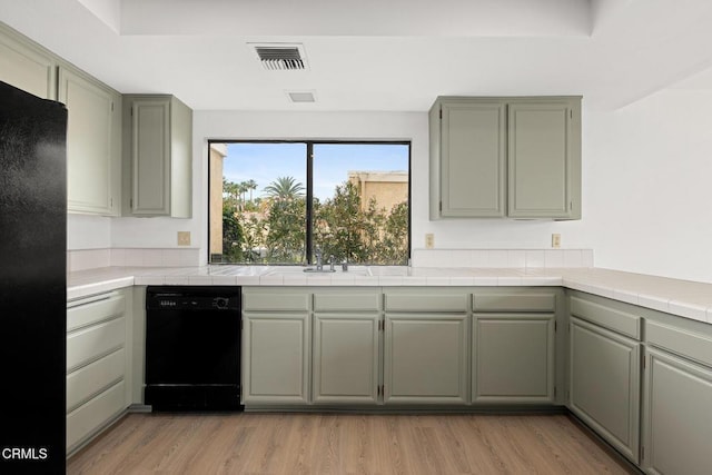 72460 Rodeo Way, Rancho Mirage, CA 92270 - kitchen featuring black appliances, gray cabinets, light wood-style flooring, and tile counters