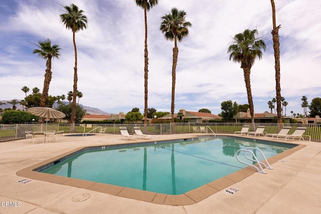 72460 Rodeo Way, Rancho Mirage, CA 92270 - community pool featuring a patio, fence, and a mountain view