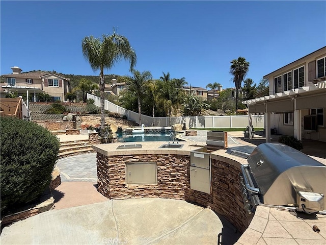 36613 Wandering Pl, Murrieta, CA 92563 - view of patio / terrace with a fenced backyard, area for grilling, a sink, and a residential view