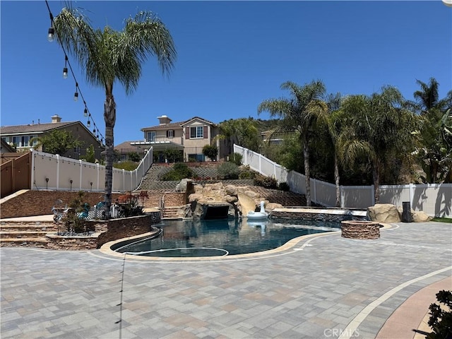 36613 Wandering Pl, Murrieta, CA 92563 - view of swimming pool featuring a fenced backyard, a patio, a fire pit, and a pool with connected hot tub