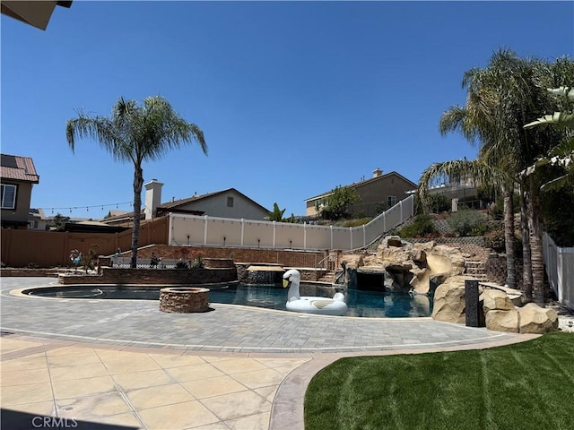 36613 Wandering Pl, Murrieta, CA 92563 - view of pool with a fenced backyard, a patio, and a fire pit