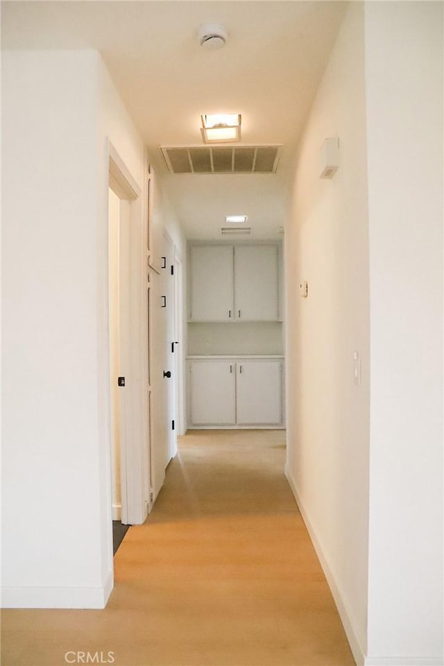 16109 Chuka Ave, Palmdale, CA 93591 - hallway with light wood-type flooring and baseboards