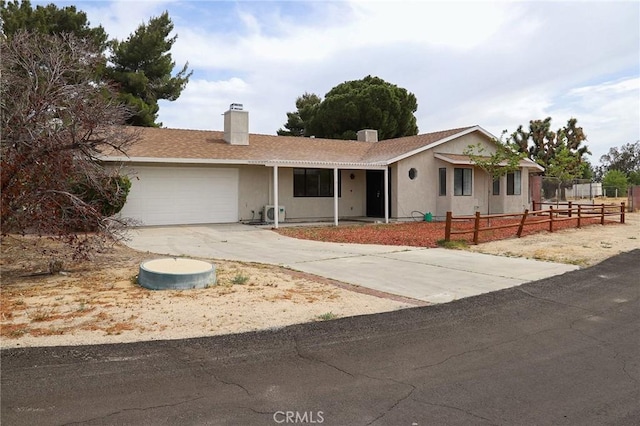16109 Chuka Ave, Palmdale, CA 93591 - ranch-style house featuring fence, an attached garage, a chimney, and driveway