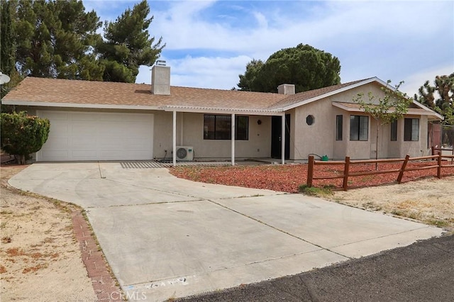 16109 Chuka Ave, Palmdale, CA 93591 - ranch-style home with an attached garage, a chimney, ac unit, driveway, and fence