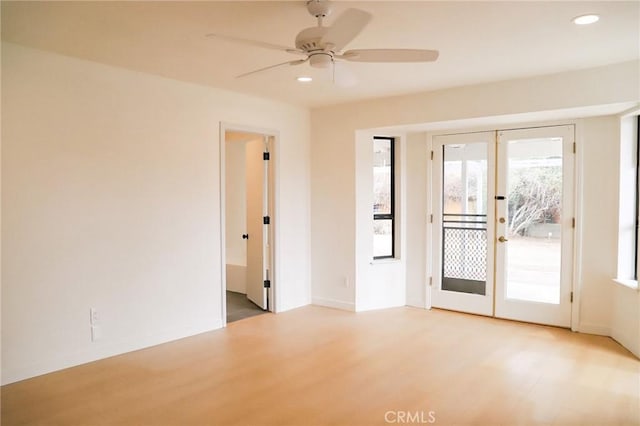 16109 Chuka Ave, Palmdale, CA 93591 - empty room with french doors, ceiling fan, wood finished floors, and recessed lighting