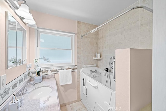 18633 Gledhill St, Northridge, CA 91324 - full bathroom with tile walls, vanity, and tile patterned floors