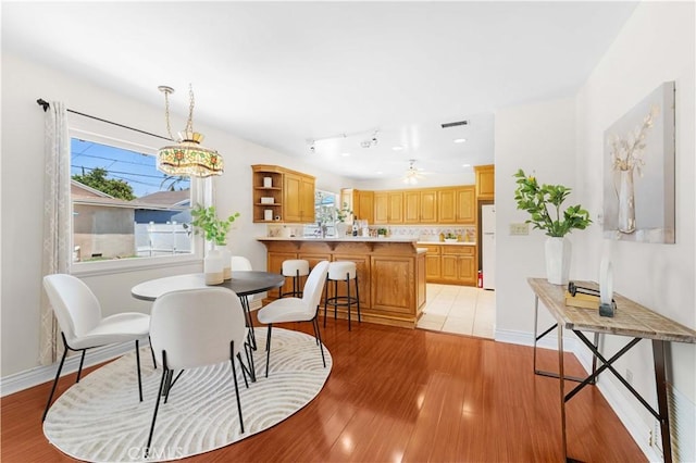 18633 Gledhill St, Northridge, CA 91324 - dining area featuring light wood-style flooring and baseboards