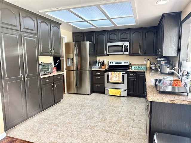 25453 Via Novia, Valencia, CA 91355 - kitchen with stainless steel appliances and a sink