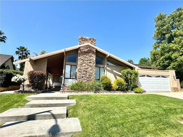 25453 Via Novia, Valencia, CA 91355 - mid-century inspired home featuring a garage, a front lawn, concrete driveway, a chimney, and stucco siding