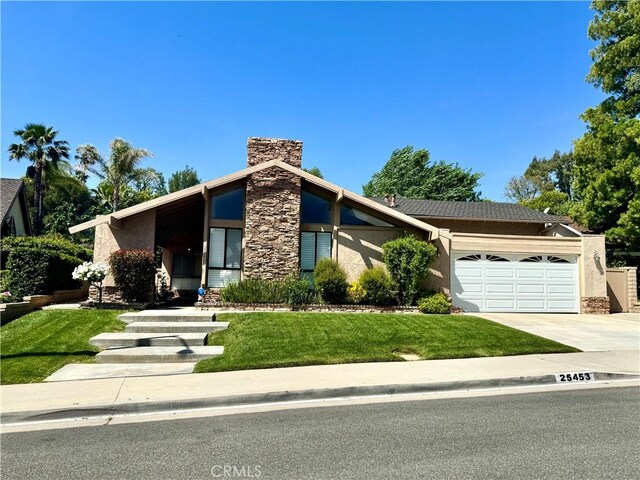 25453 Via Novia, Valencia, CA 91355 - mid-century modern home with stucco siding, a garage, driveway, a chimney, and a front yard