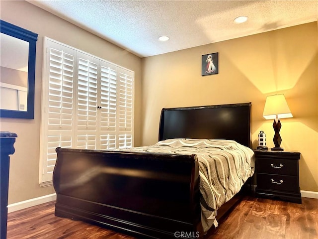 25453 Via Novia, Valencia, CA 91355 - bedroom featuring a textured ceiling, baseboards, wood finished floors, and recessed lighting