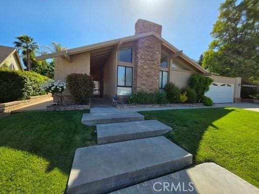25453 Via Novia, Valencia, CA 91355 - mid-century modern home featuring a front lawn and stucco siding