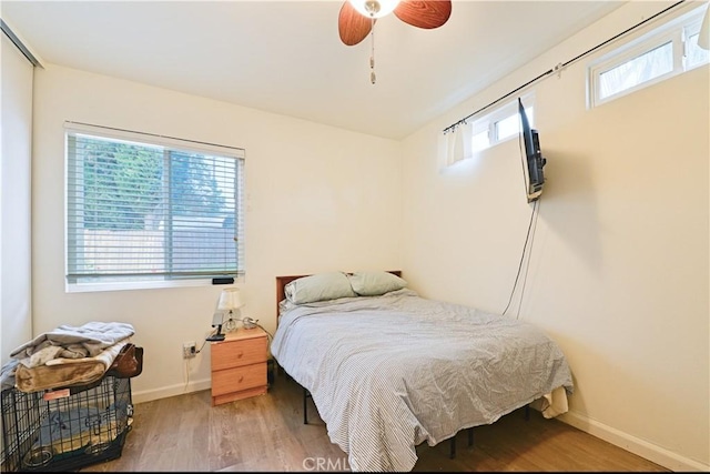 13142 Reedley St, Arleta, CA 91331 - bedroom with wood finished floors, baseboards, and a ceiling fan