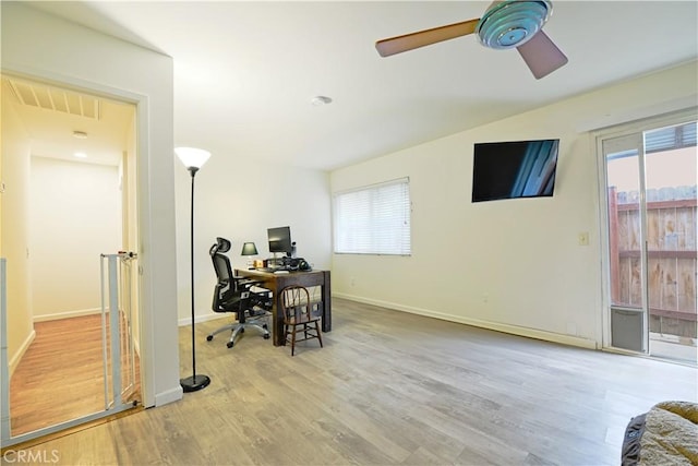 13142 Reedley St, Arleta, CA 91331 - office space with a ceiling fan, plenty of natural light, wood finished floors, and baseboards