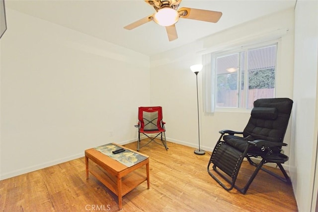 13142 Reedley St, Arleta, CA 91331 - living area featuring light wood-type flooring, a ceiling fan, and baseboards