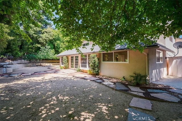2521 Wildrose Ln, Upland, CA 91784 - rear view of property with a patio area and stucco siding
