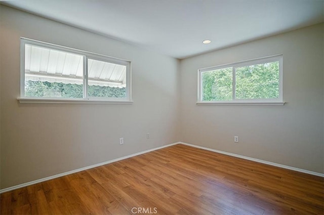 2521 Wildrose Ln, Upland, CA 91784 - spare room with wood finished floors and recessed lighting