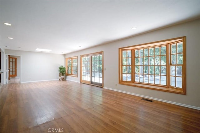 2521 Wildrose Ln, Upland, CA 91784 - unfurnished living room featuring wood finished floors and recessed lighting