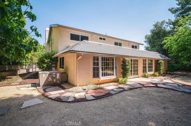 2521 Wildrose Ln, Upland, CA 91784 - rear view of property with stucco siding and a patio