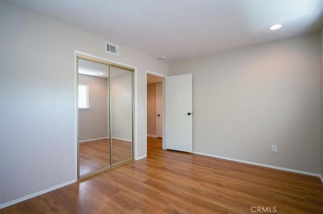 2521 Wildrose Ln, Upland, CA 91784 - unfurnished bedroom featuring wood finished floors, a closet, and recessed lighting
