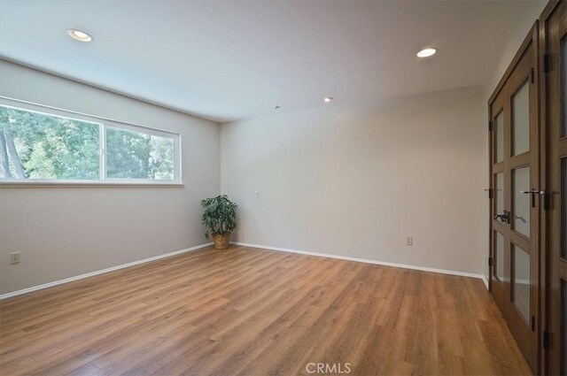 2521 Wildrose Ln, Upland, CA 91784 - spare room featuring light wood-style floors and recessed lighting