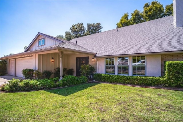 2521 Wildrose Ln, Upland, CA 91784 - view of front facade with an attached garage, board and batten siding, a front lawn, and a shingled roof