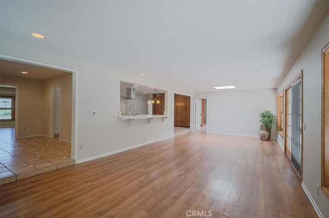 2521 Wildrose Ln, Upland, CA 91784 - unfurnished living room featuring wood finished floors and recessed lighting