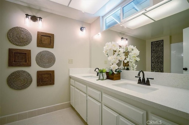 2521 Wildrose Ln, Upland, CA 91784 - full bathroom featuring double vanity, tile patterned flooring, and a shower