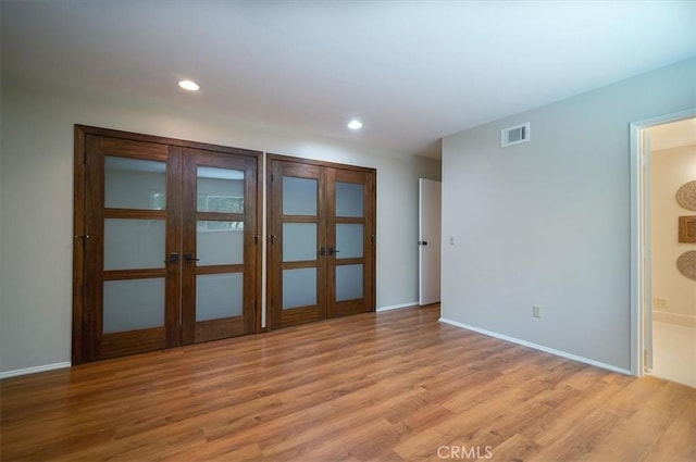 2521 Wildrose Ln, Upland, CA 91784 - spare room with french doors, light wood-style flooring, and recessed lighting