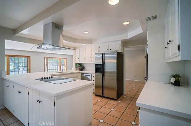 2521 Wildrose Ln, Upland, CA 91784 - kitchen with appliances with stainless steel finishes, island exhaust hood, a raised ceiling, a peninsula, and white cabinets