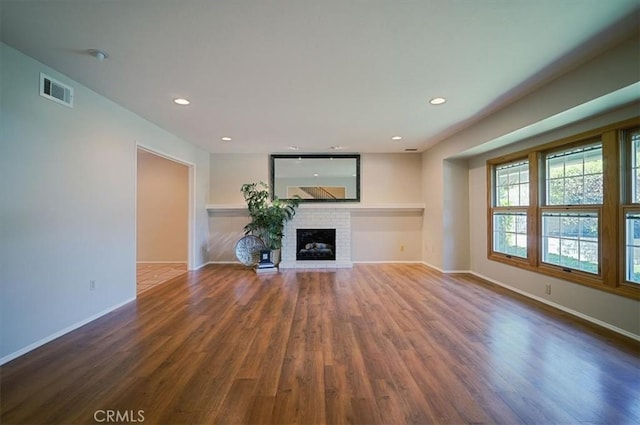 2521 Wildrose Ln, Upland, CA 91784 - unfurnished living room featuring wood finished floors, a brick fireplace, and recessed lighting