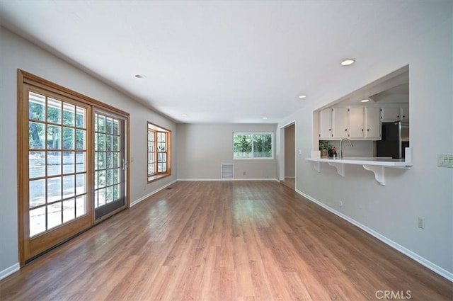2521 Wildrose Ln, Upland, CA 91784 - unfurnished living room featuring light wood finished floors and recessed lighting