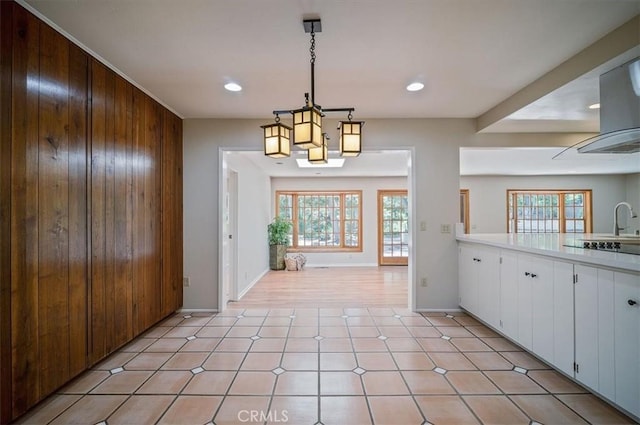 2521 Wildrose Ln, Upland, CA 91784 - unfurnished dining area with wooden walls, plenty of natural light, and recessed lighting