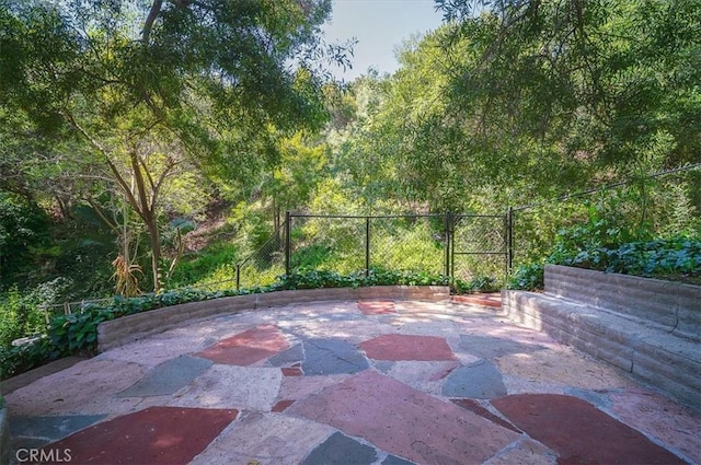 2521 Wildrose Ln, Upland, CA 91784 - view of patio / terrace with a gate and a wooded view