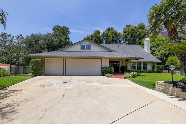 2521 Wildrose Ln, Upland, CA 91784 - view of front facade with an attached garage, concrete driveway, and a chimney